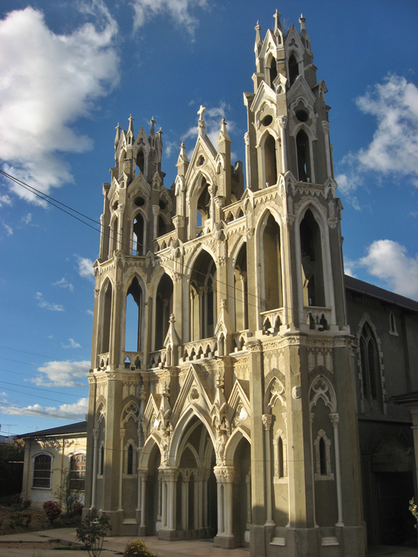 Exterior of Cristo Pobre Chapel showing neo-Gothic facade with twin spires